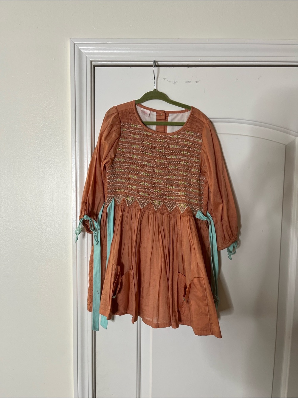 Well Dressed Wolf Peach Smocked Cotton Dress with Aqua Ribbon Accent and shorts